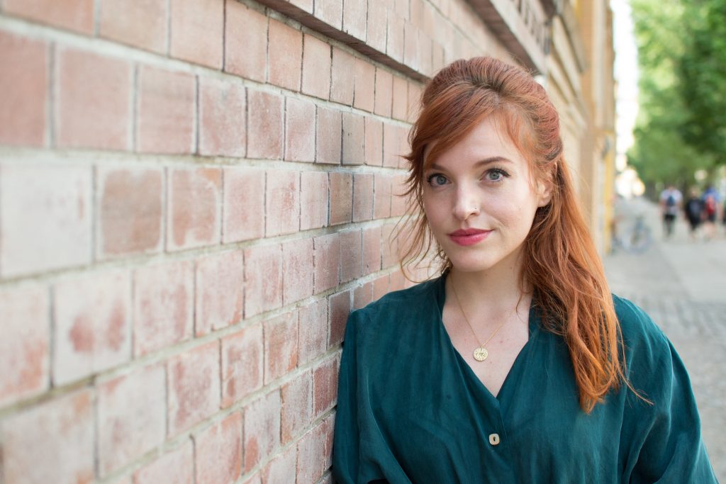 Whitney Buchanan leaning against a wall